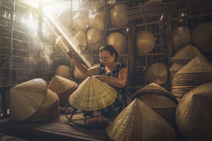 Vietnam Village Life: Vietnamese Old woman craftsman 