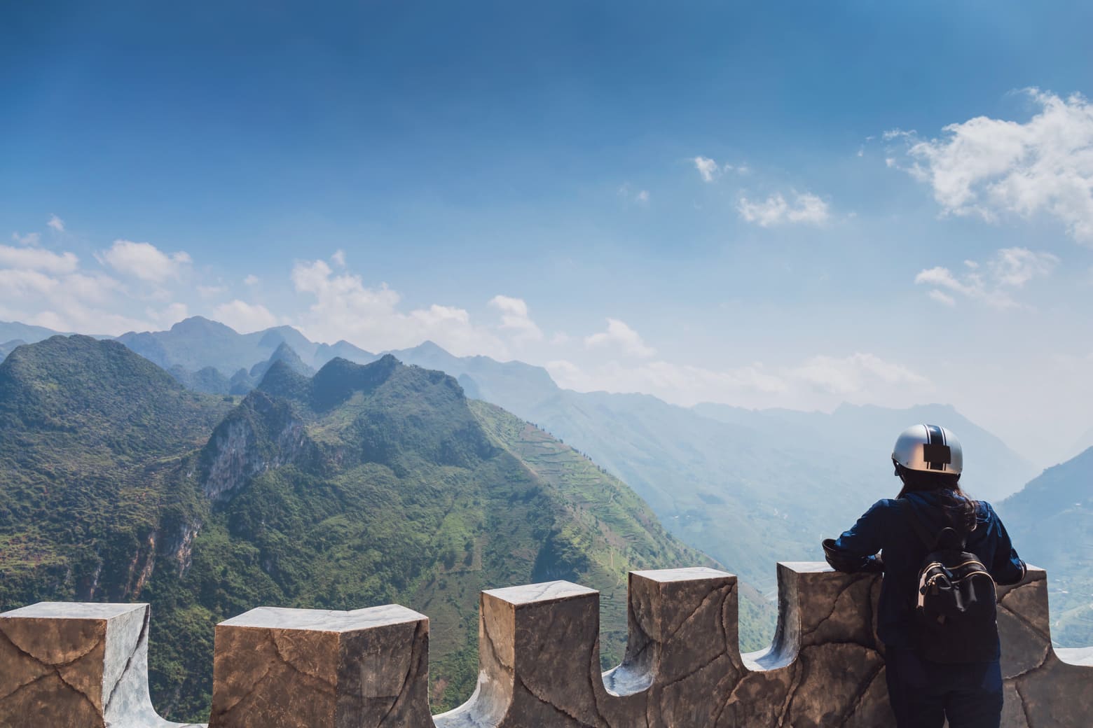ha giang trekker hike to top of mountain seeing clouds